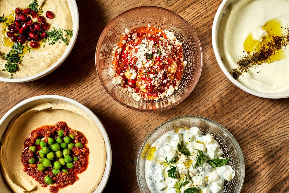 a bowl of food on a plate on a table