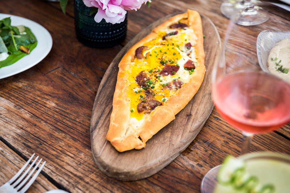 a plate of food sitting on top of a wooden table