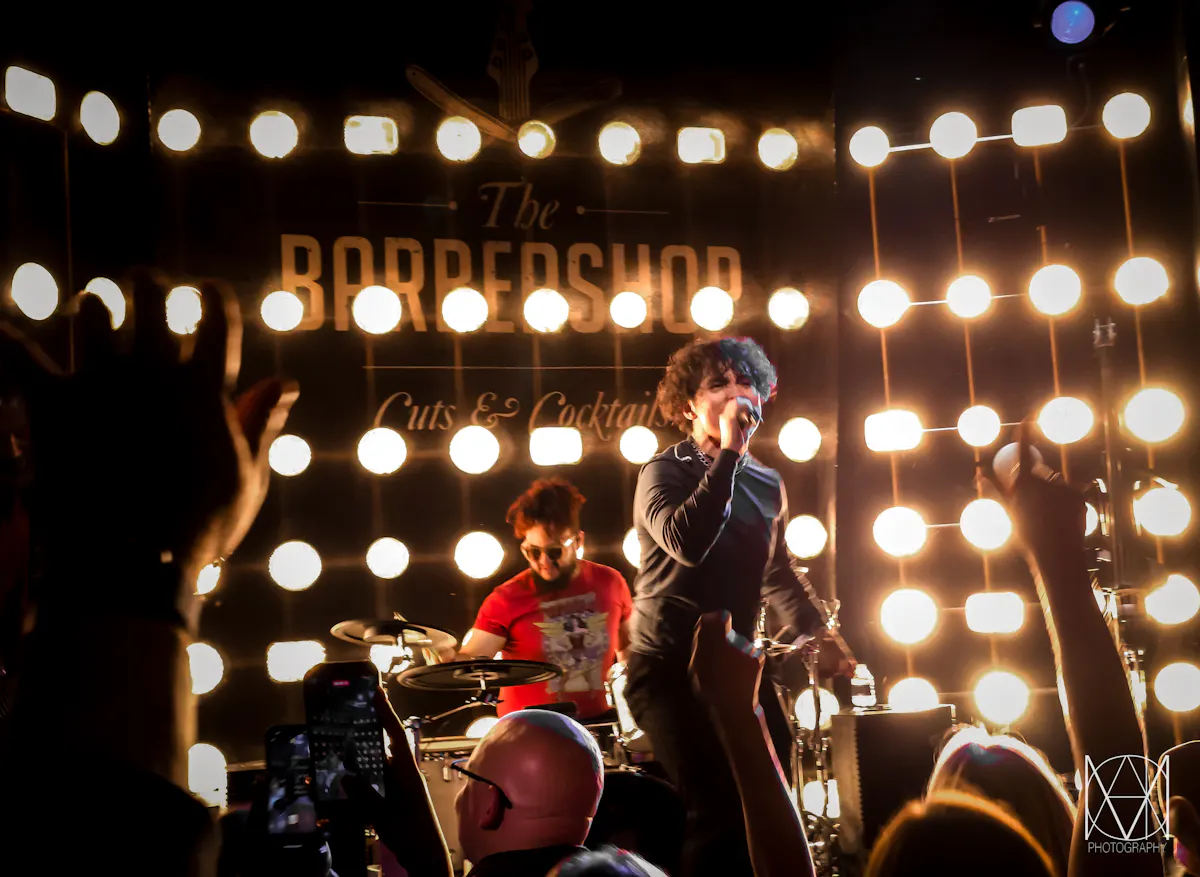 A band playing live music in LAs Vegas at The Barbershop Cuts & Cocktails