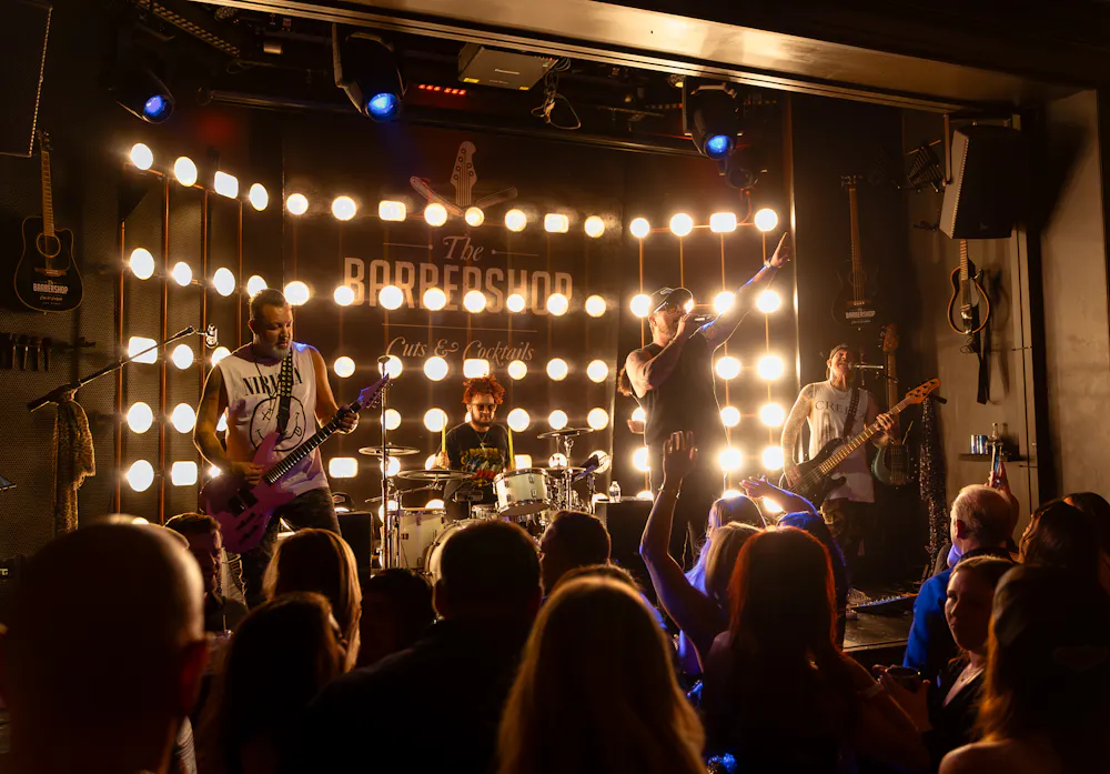 Live band on stage at the Barbershop Cuts & cocktails