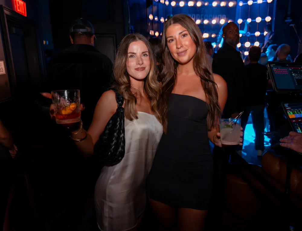 Two women at the Barbershop Cuts & Cocktails speakeasy in Las Vegas