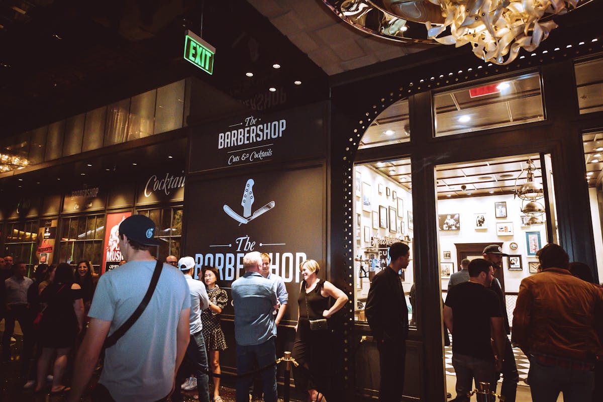 a group of people standing in front of a store