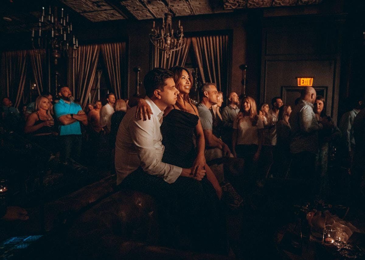 a group of people watching a band