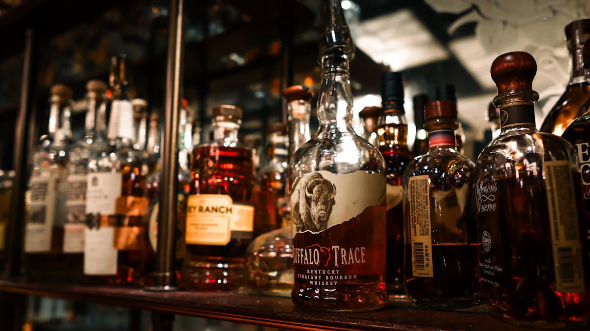 picture of whiskey on shelf at barbershop