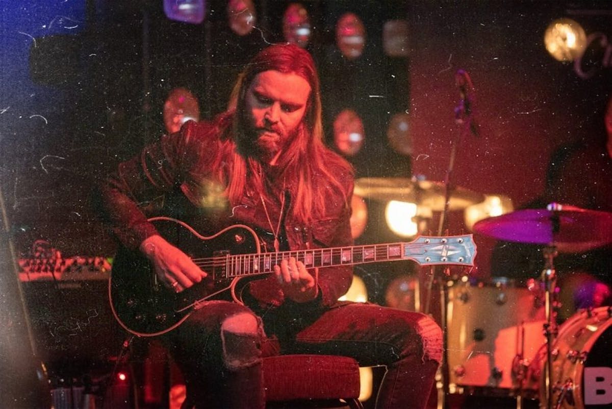 a man playing a guitar