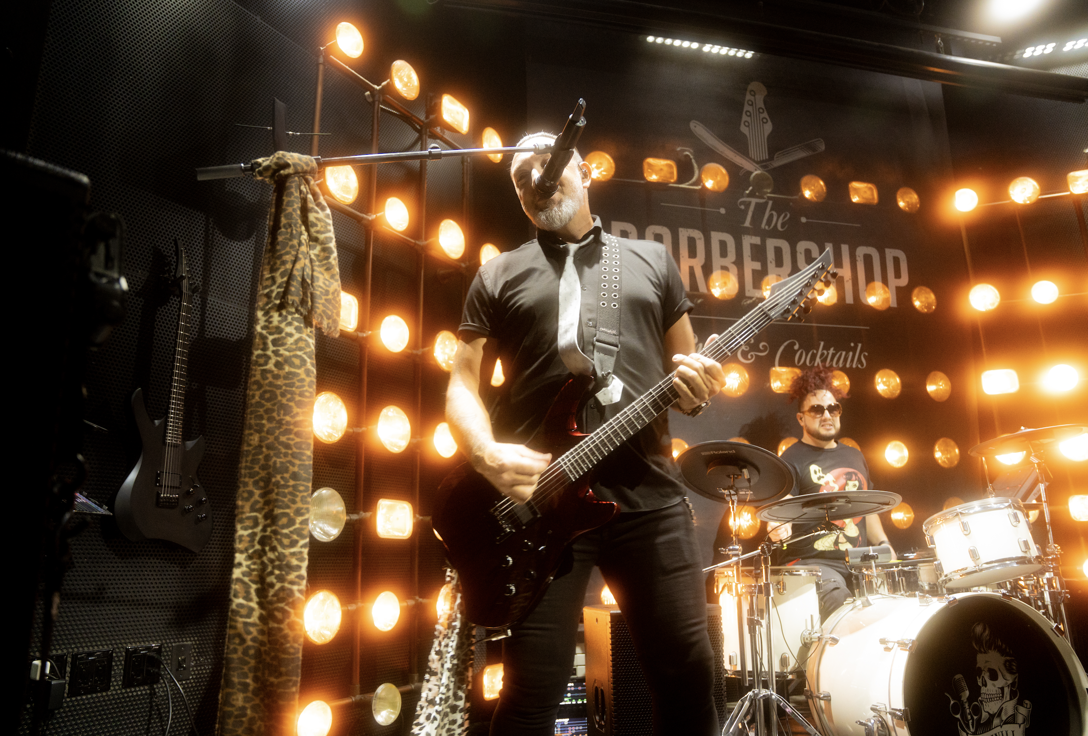 the regulators performing a headbanging guitar rif at emo night