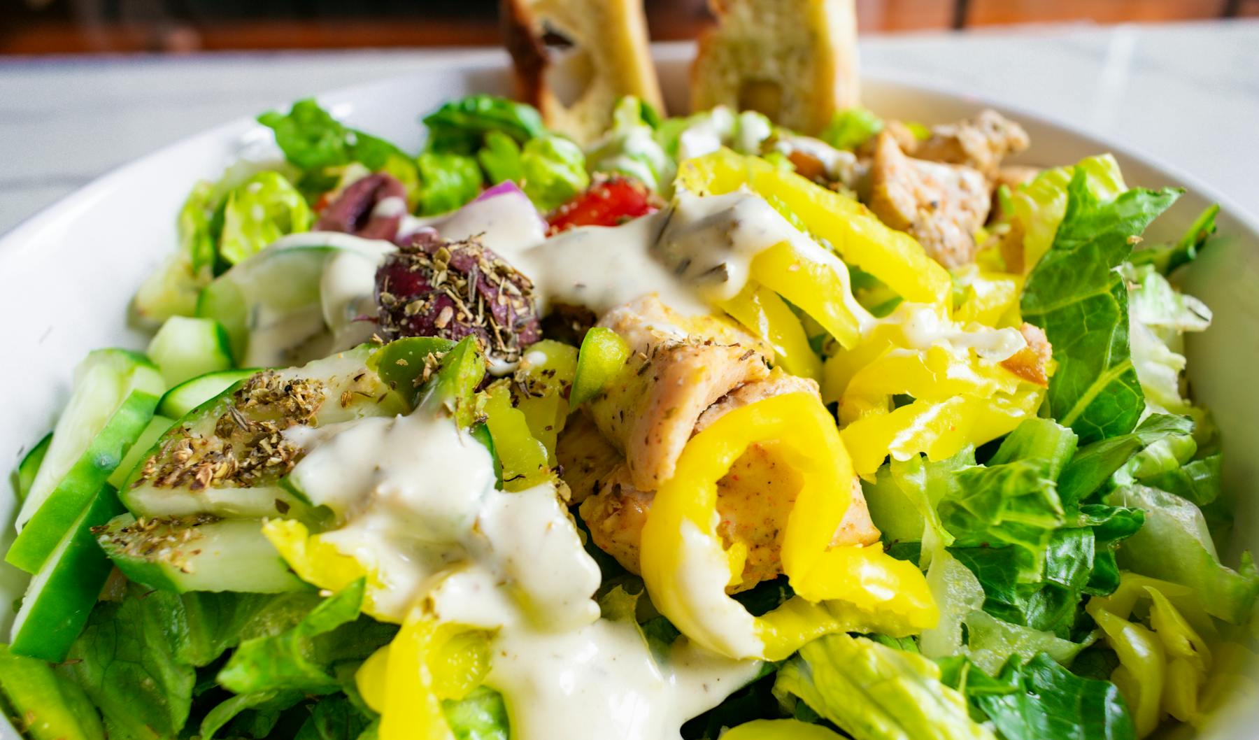 a bowl of salad on a plate
