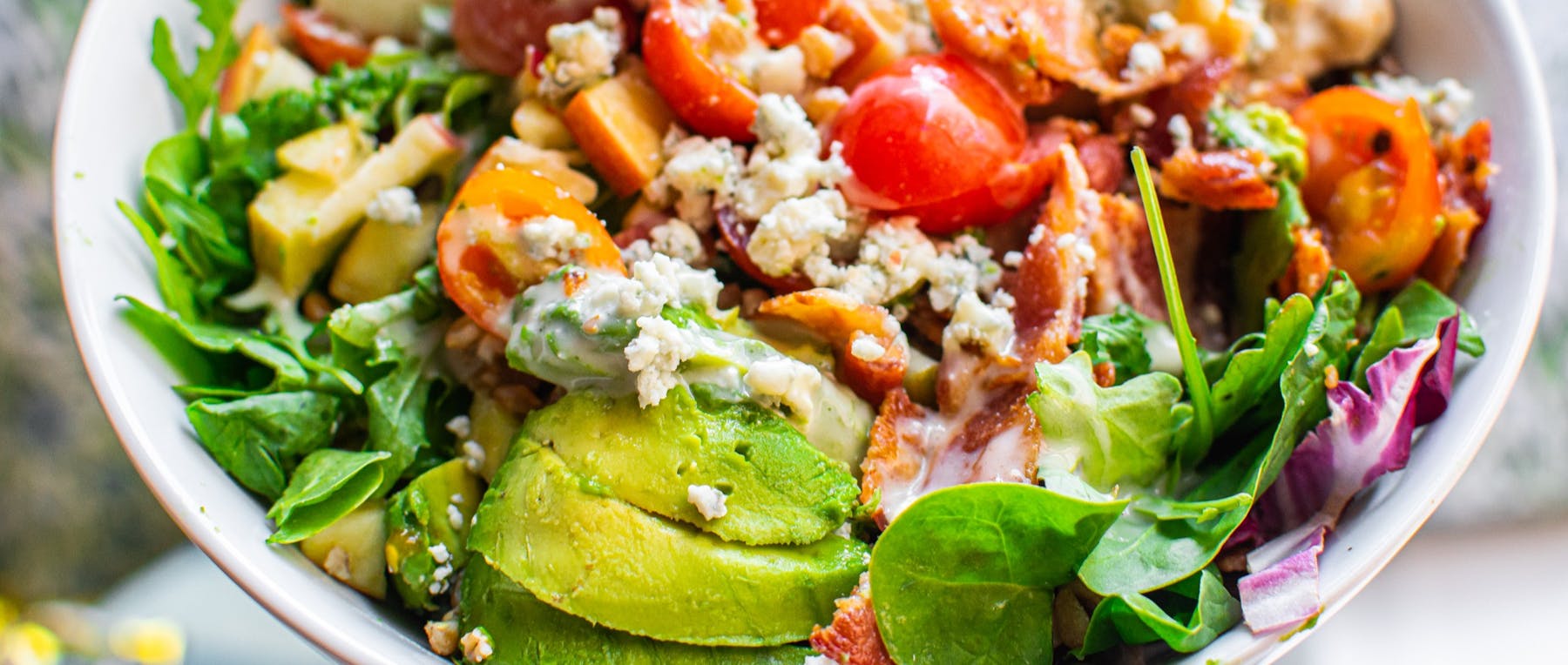 a bowl of salad on a plate