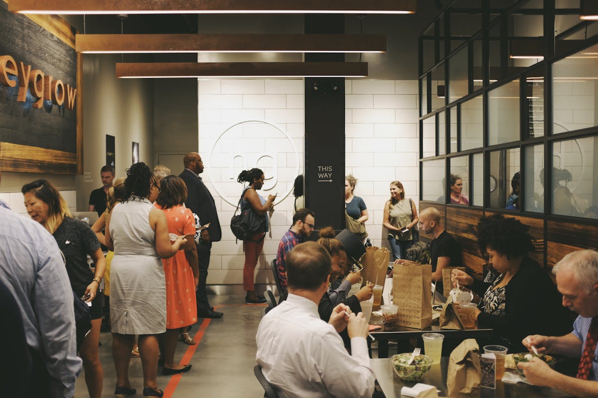 a group of people standing in front of a crowd