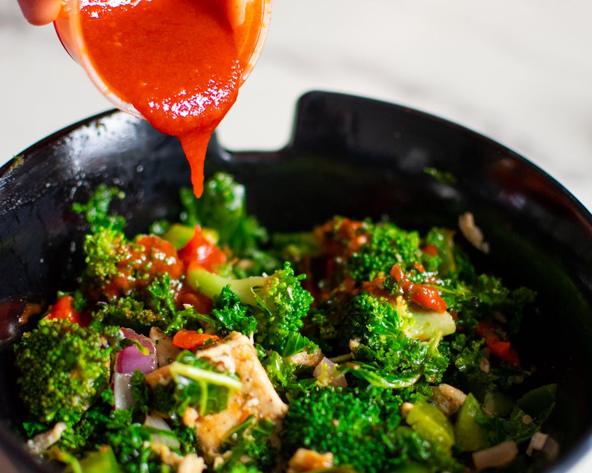 a bowl of food with broccoli