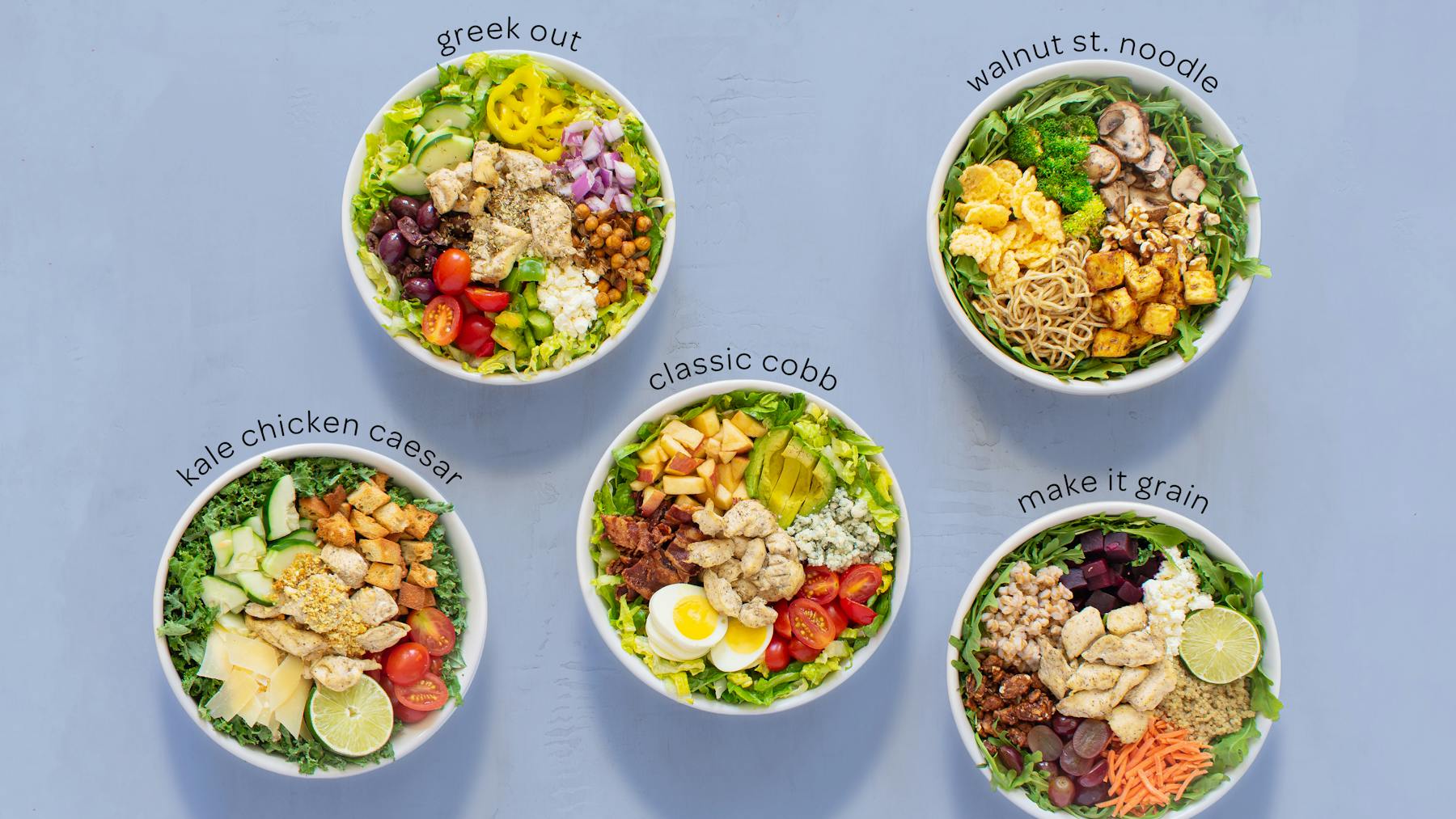 many bowls filled with salads on a table
