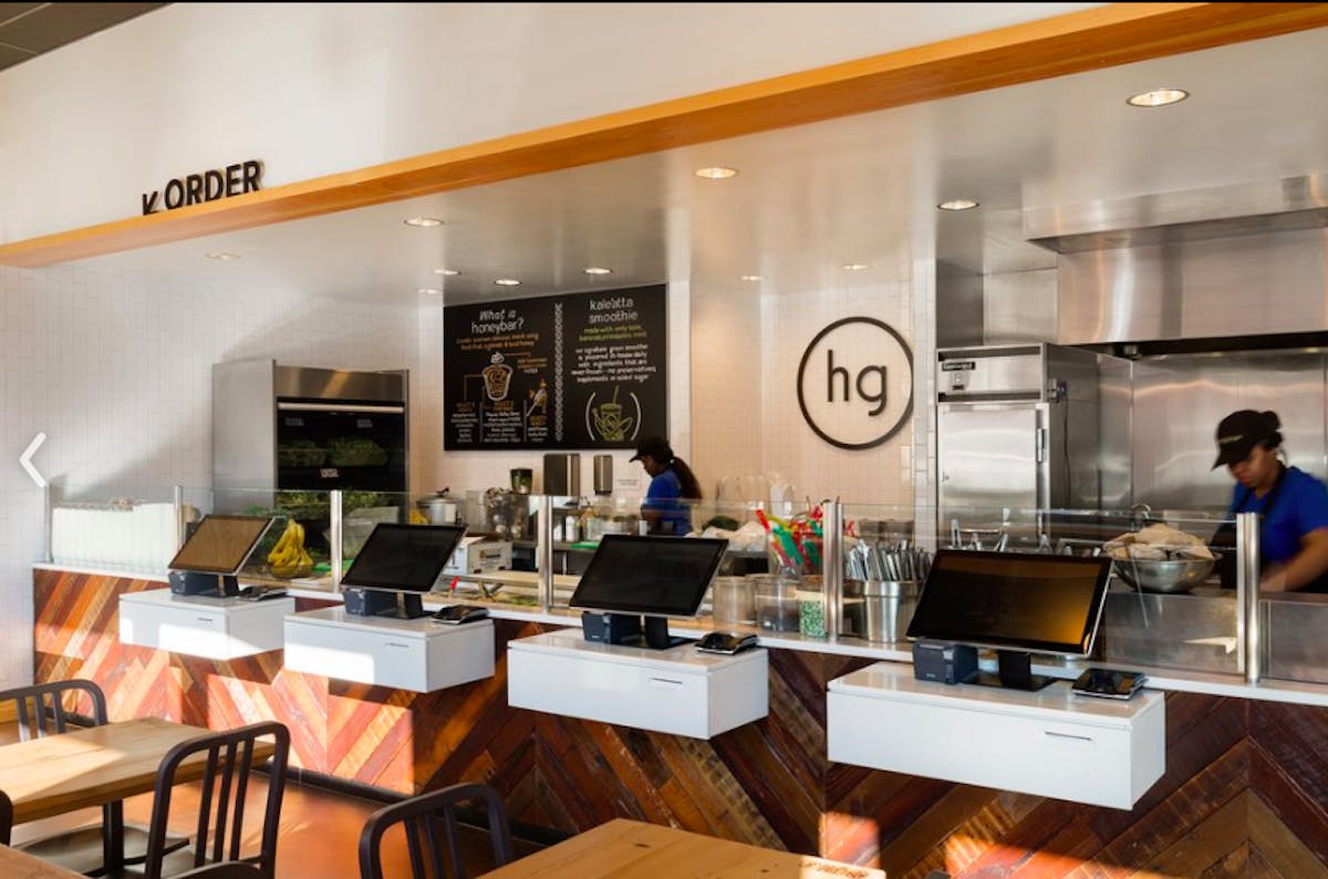 a kitchen with a table in a restaurant