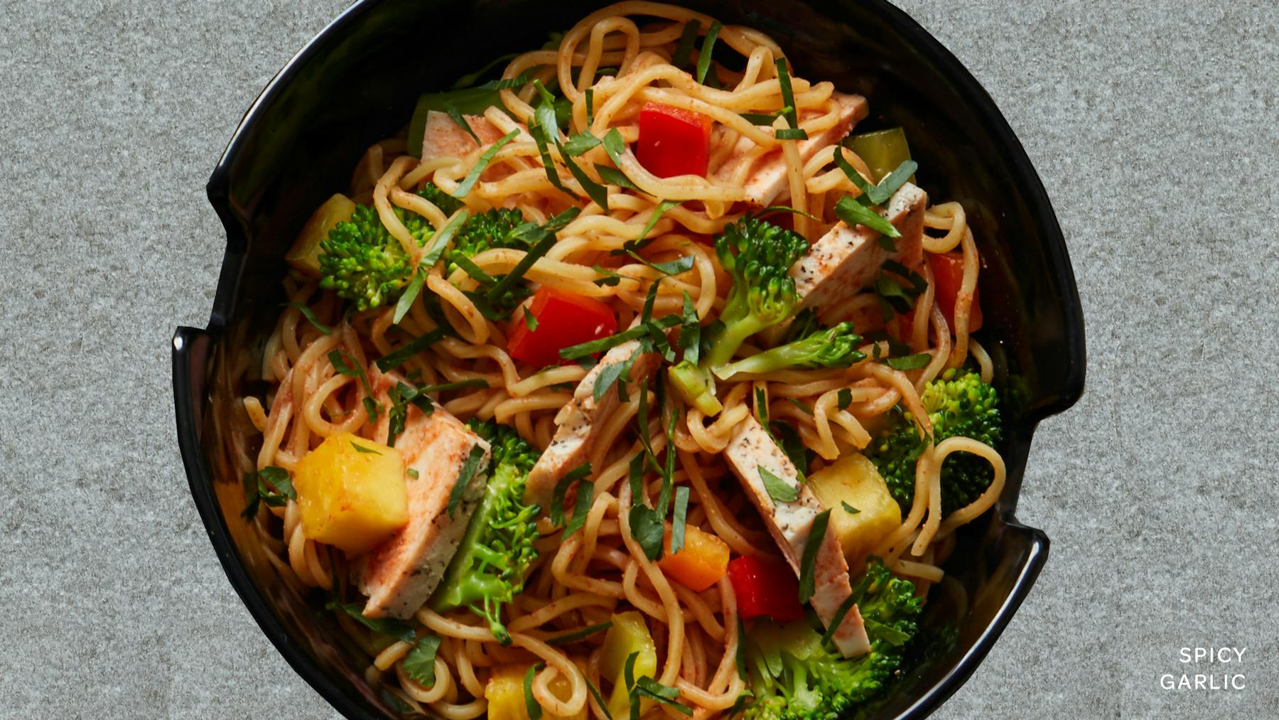 a bowl of food with broccoli