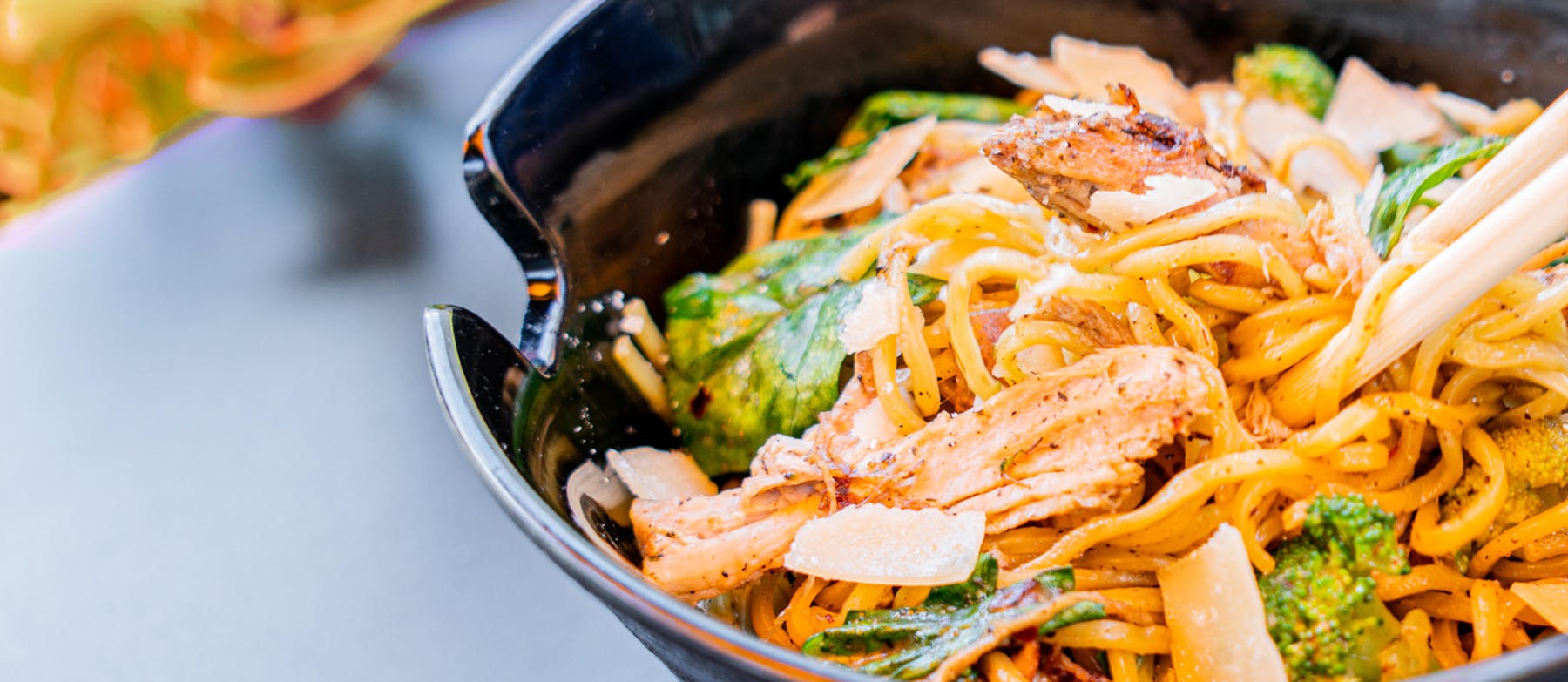 a bowl of food with broccoli