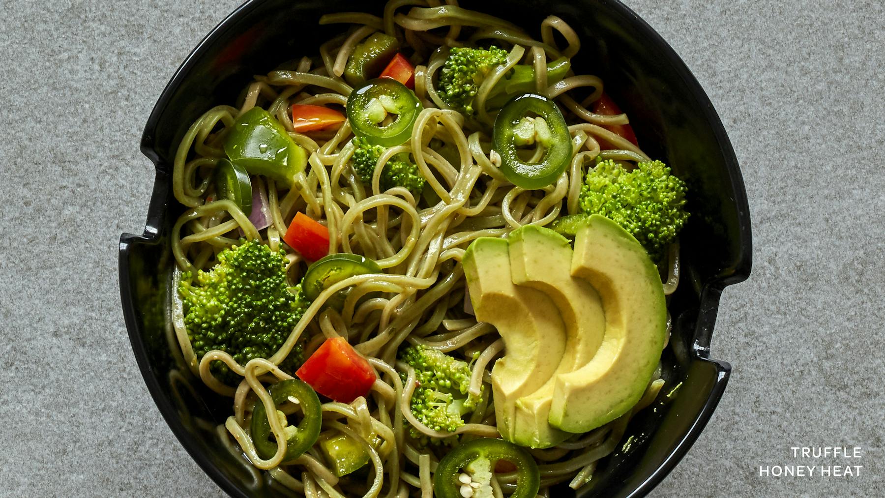 a bowl of food with broccoli