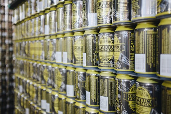 multiple cans sitting on a shelf