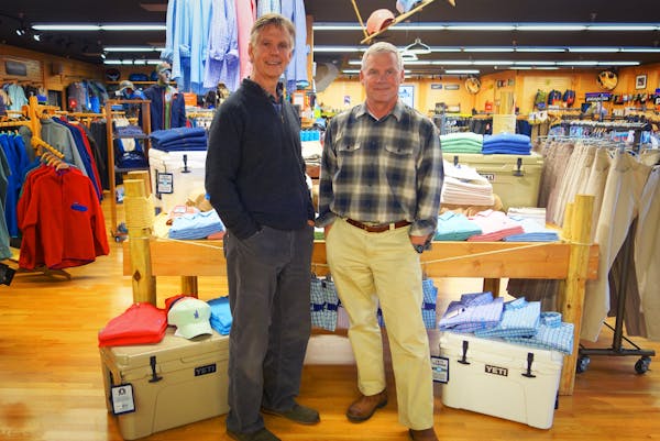 two men posing for the camera