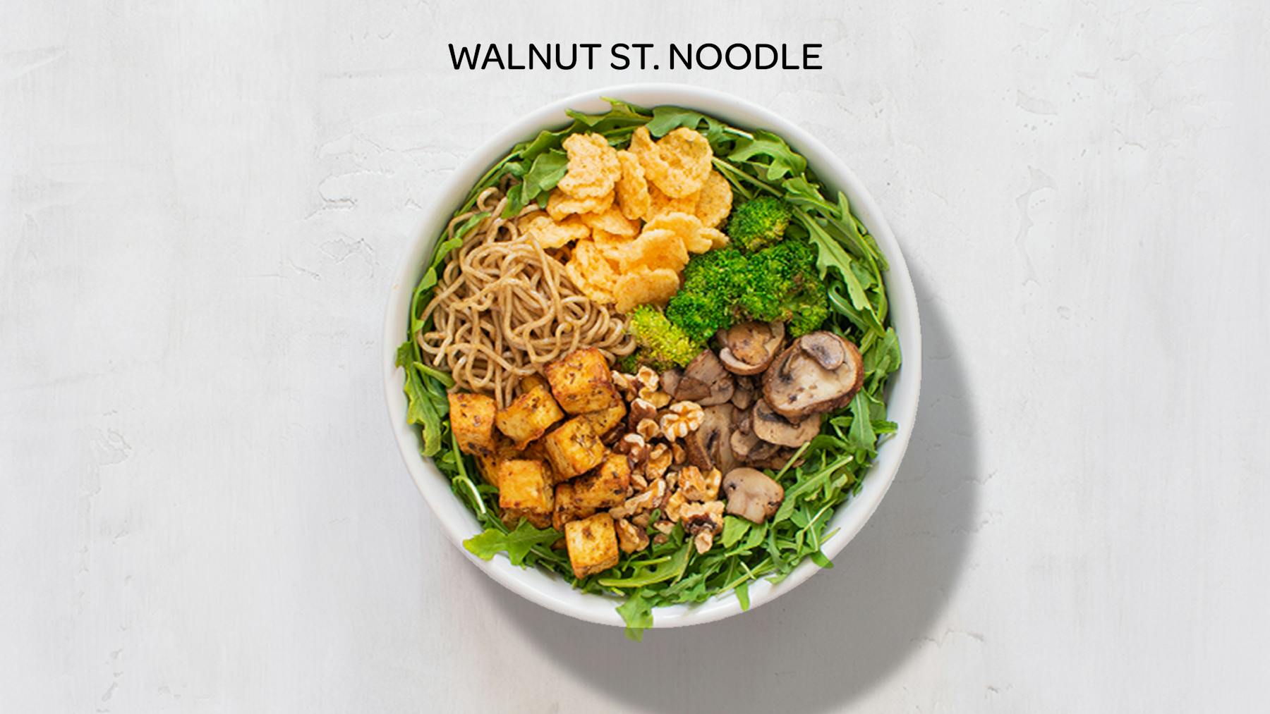 a bowl of walnut st. noodle salad