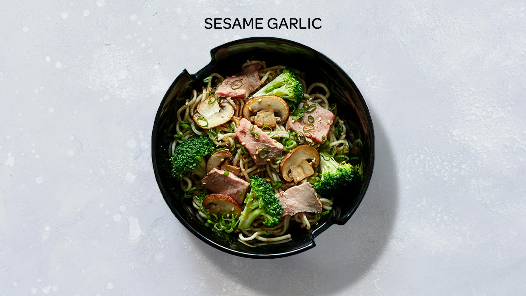 a bowl of sesame garlic stir-fry