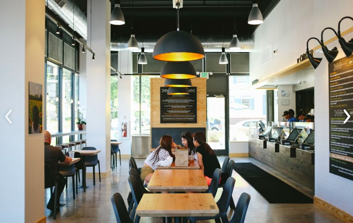 a room filled with dining tables