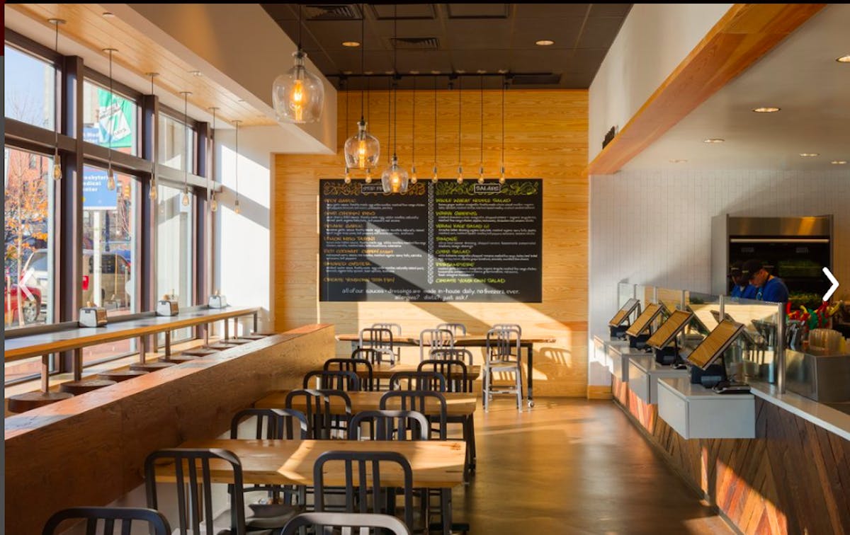 a room filled with dining tables
