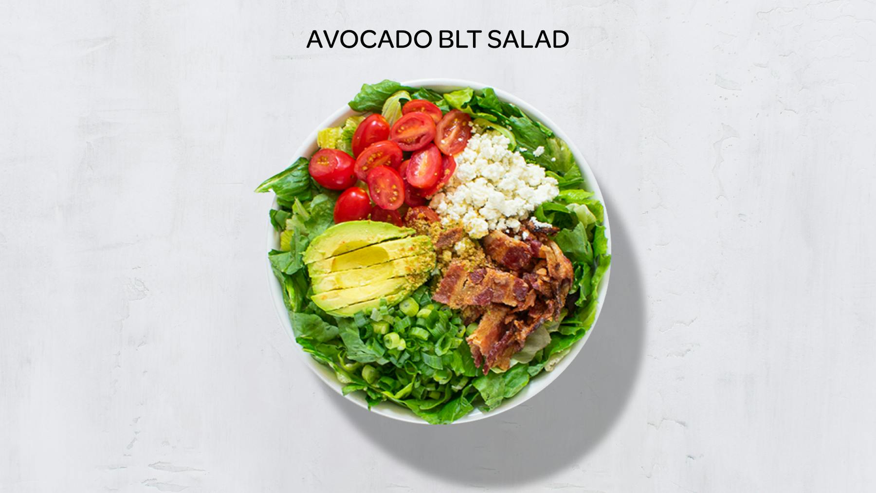 a bowl of avocado blt salad