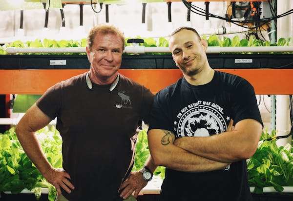 two men posing for the camera