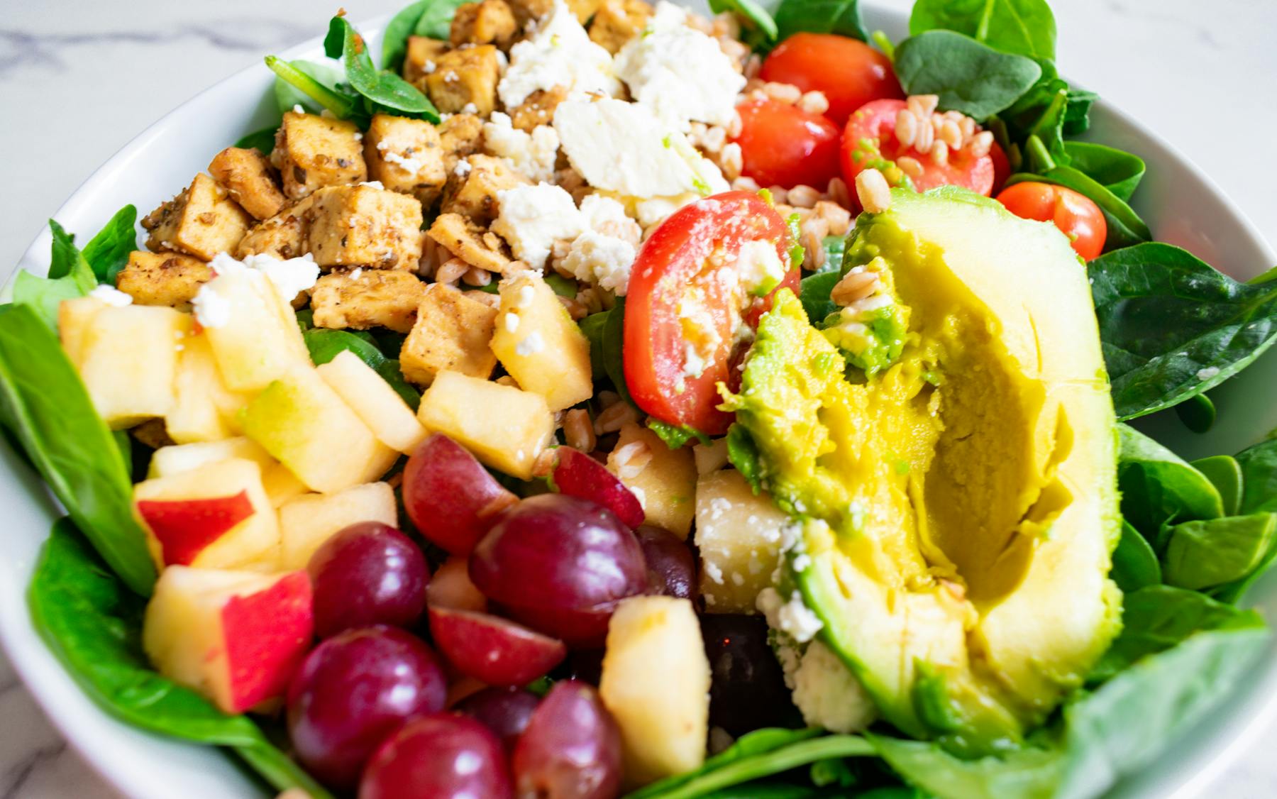 a bowl of salad on a plate