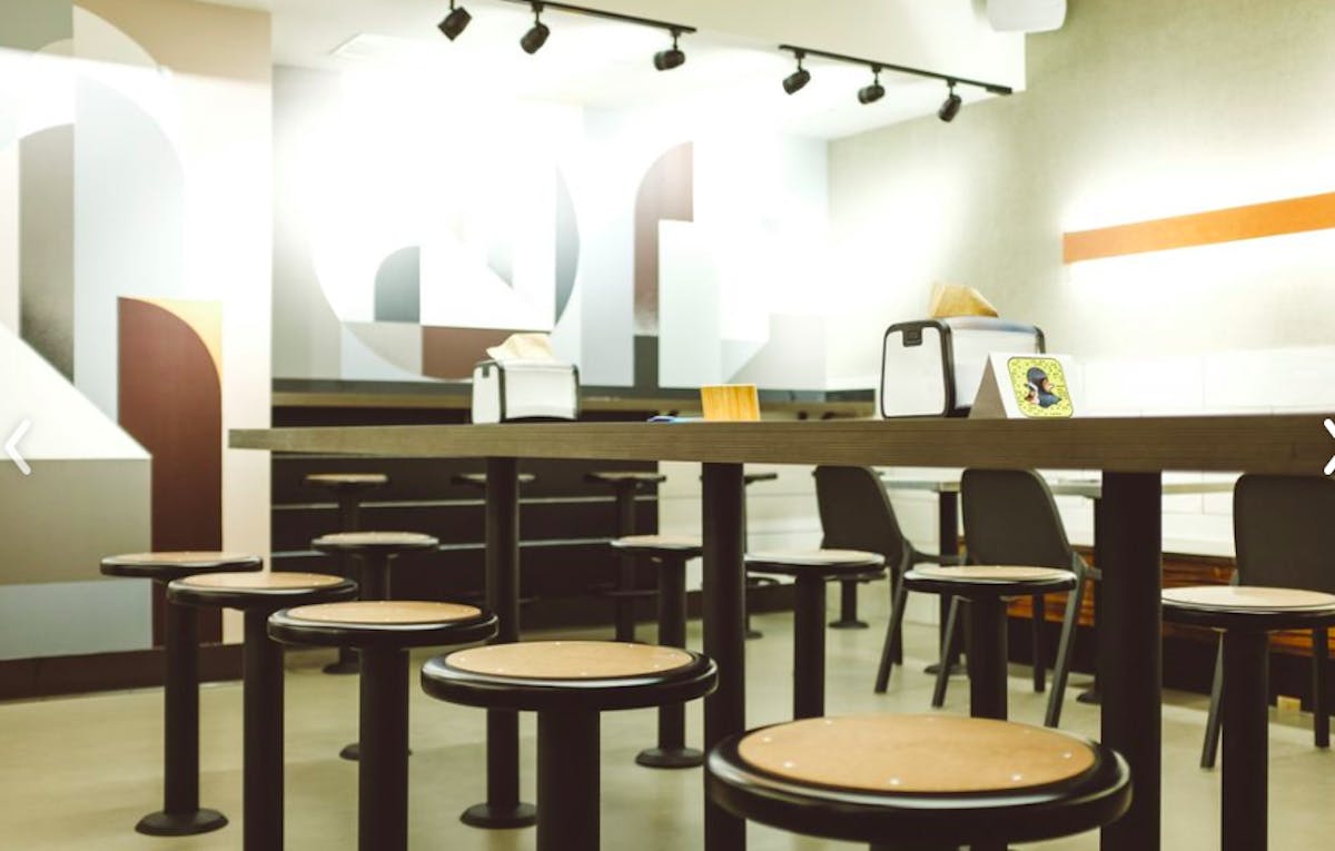 a room filled with dining tables