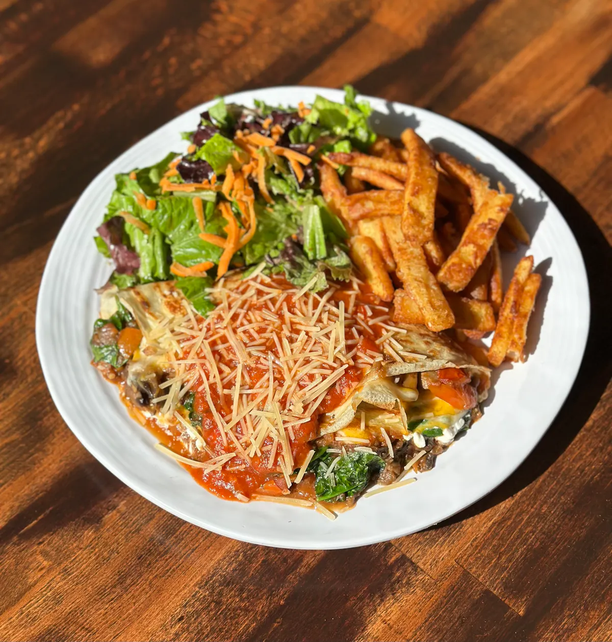 a plate of food sitting on top of a wooden table