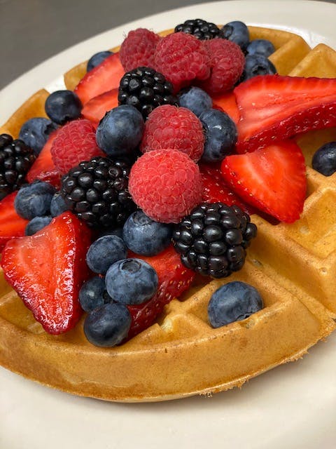 a bowl of fruit on a plate