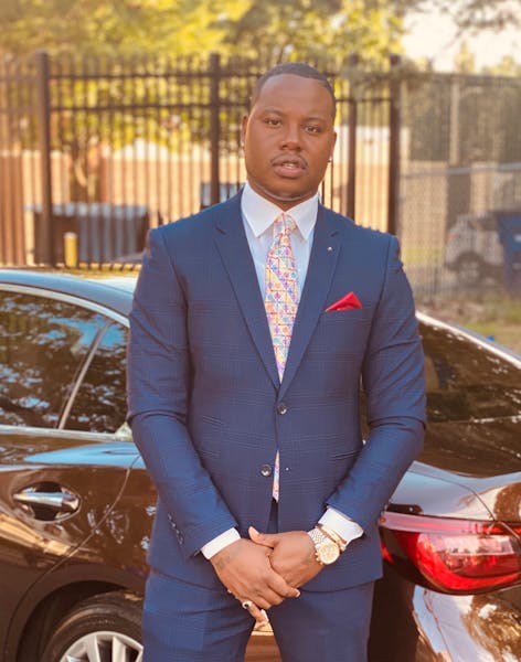 a person wearing a suit and tie