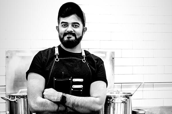 a person standing in a kitchen