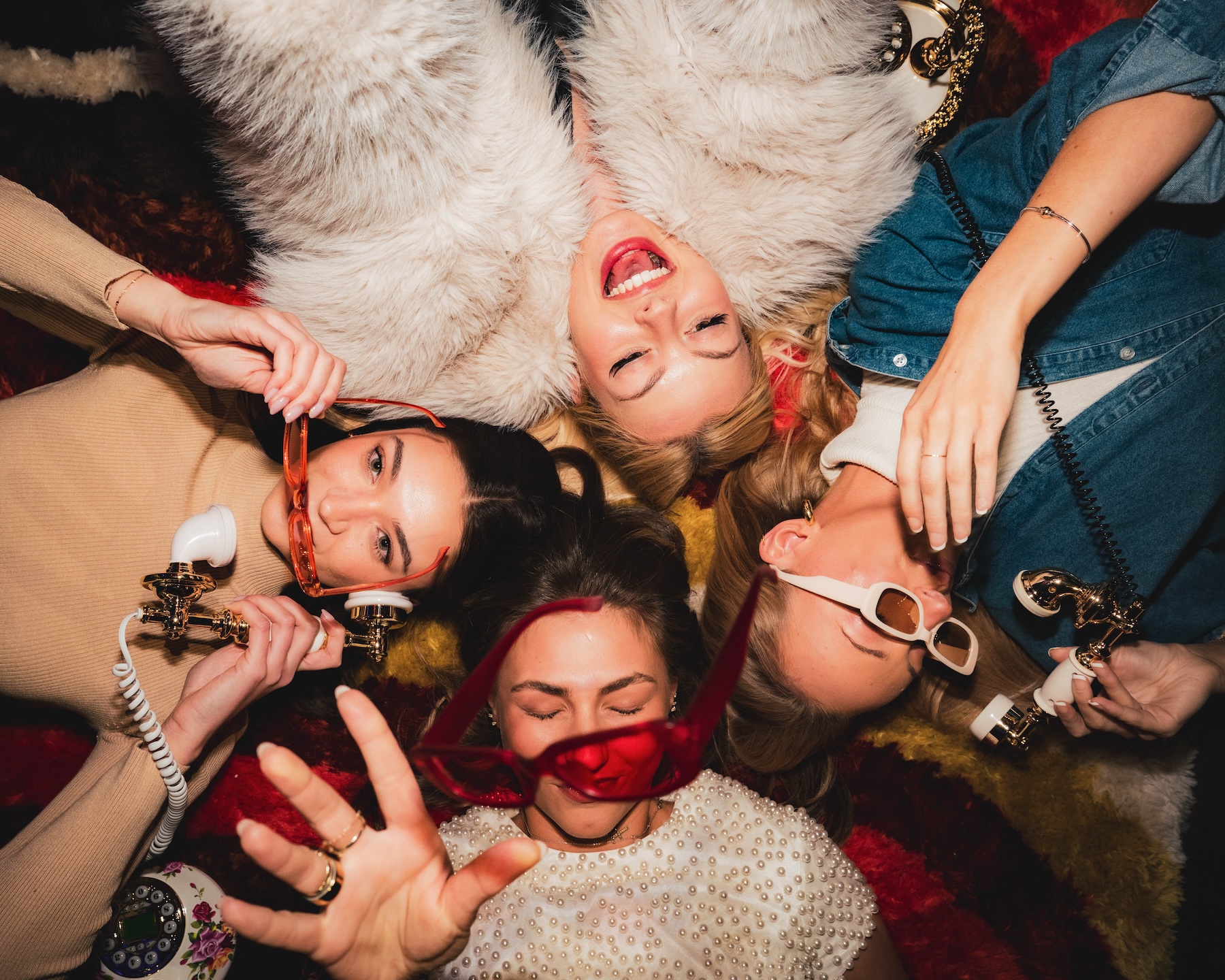 four girls posing for the camera