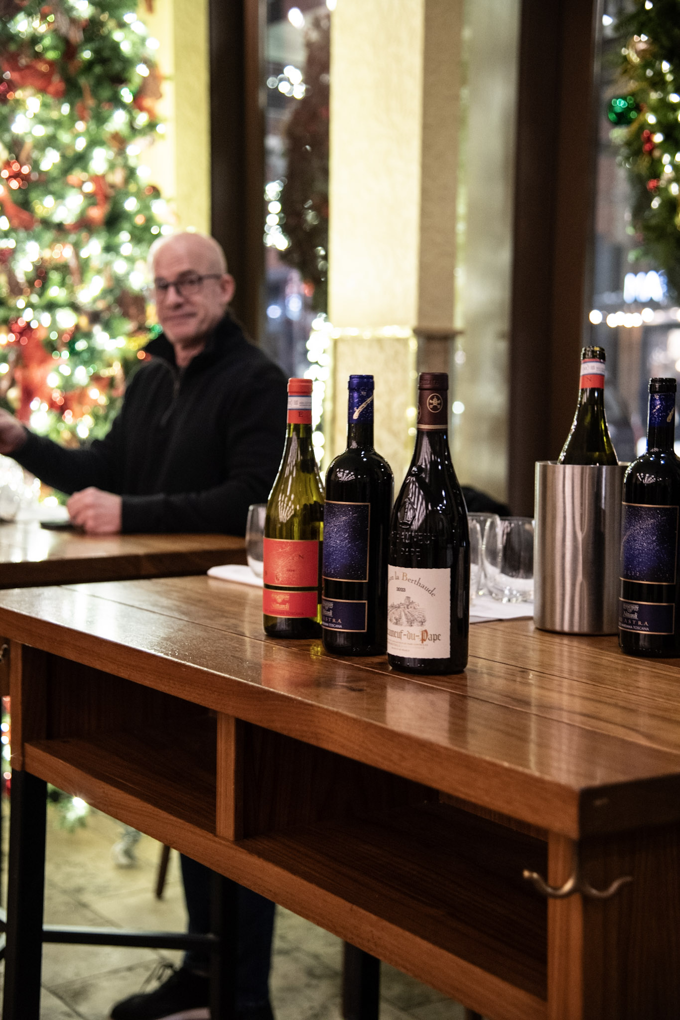 a bottle of wine and a glass of beer on a table