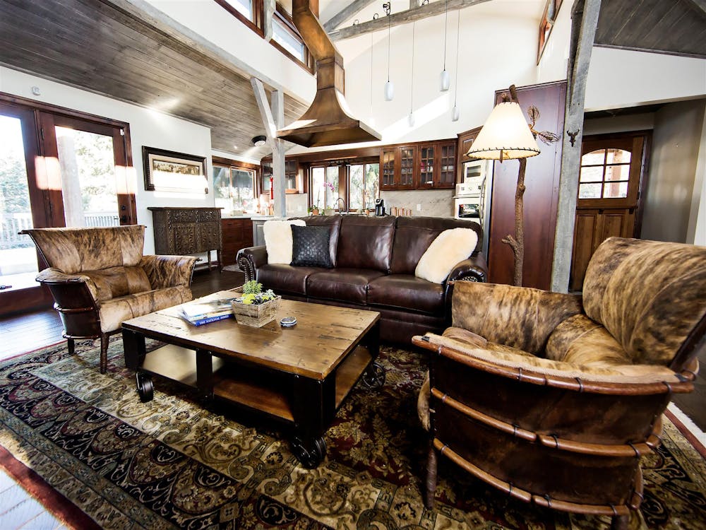 a living room filled with furniture and a large window