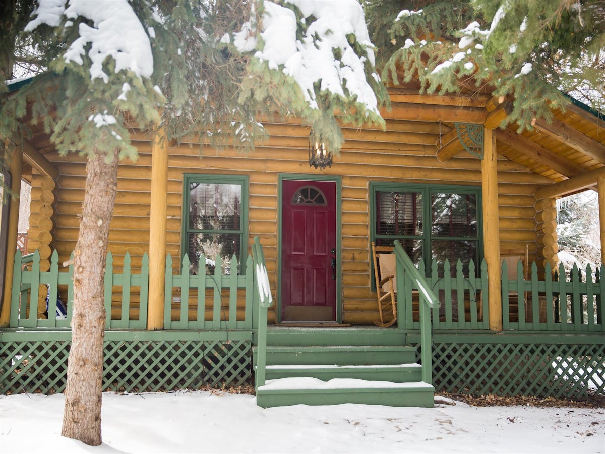 a snowy cabin entrance