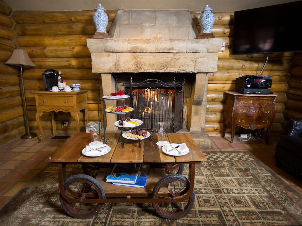 a room filled with furniture and a fireplace