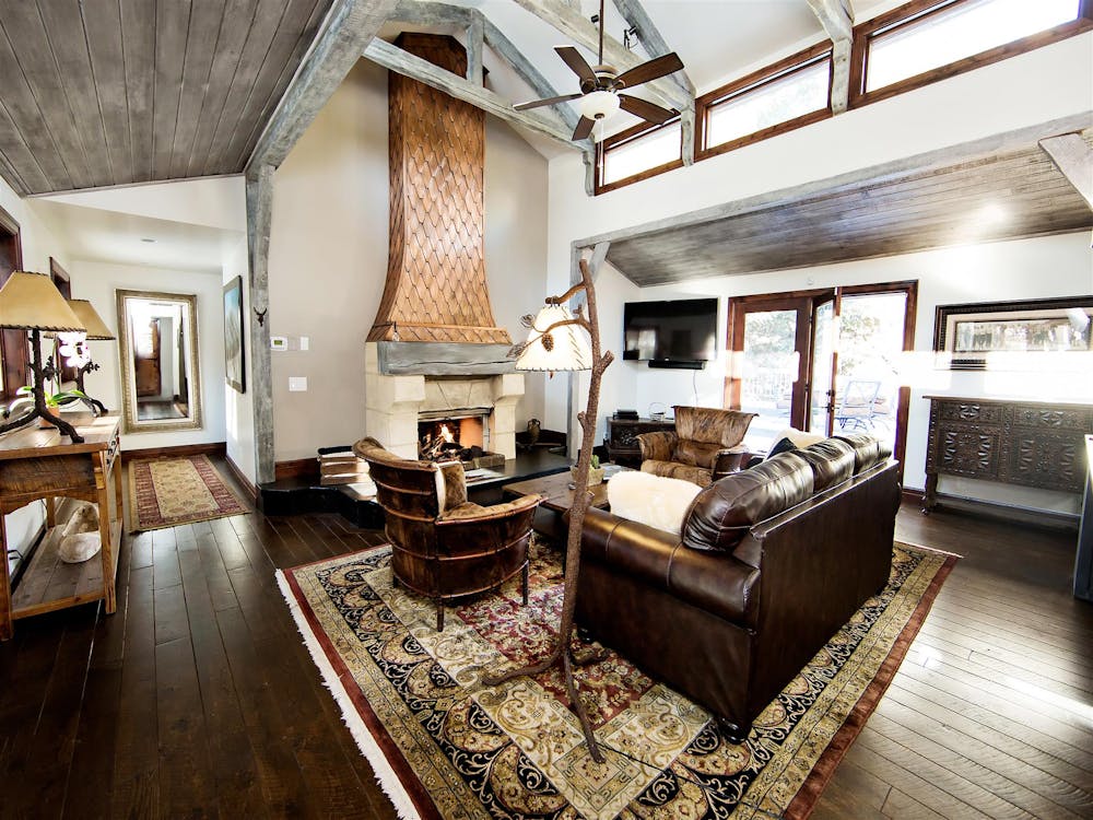 a living room filled with furniture and a fireplace