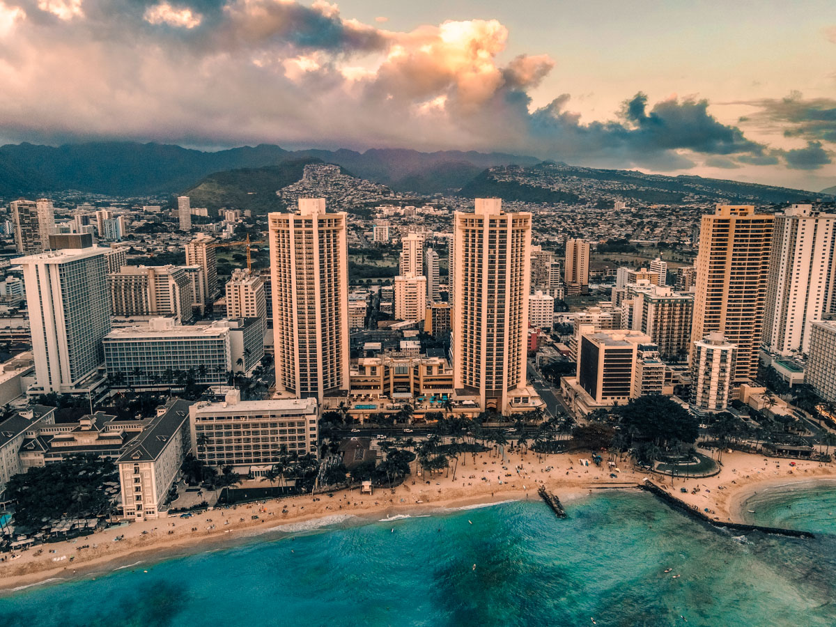 City skyline with high rises near a beach and the ocean