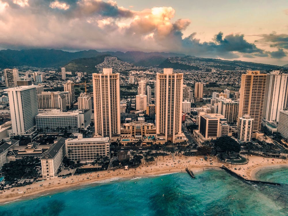 City skyline with high rises near a beach and the ocean