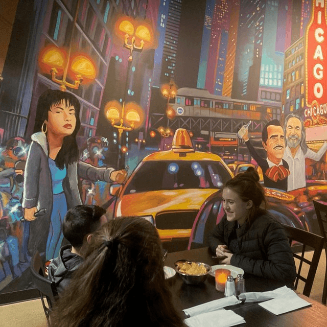 a group of people sitting at a table in a restaurant