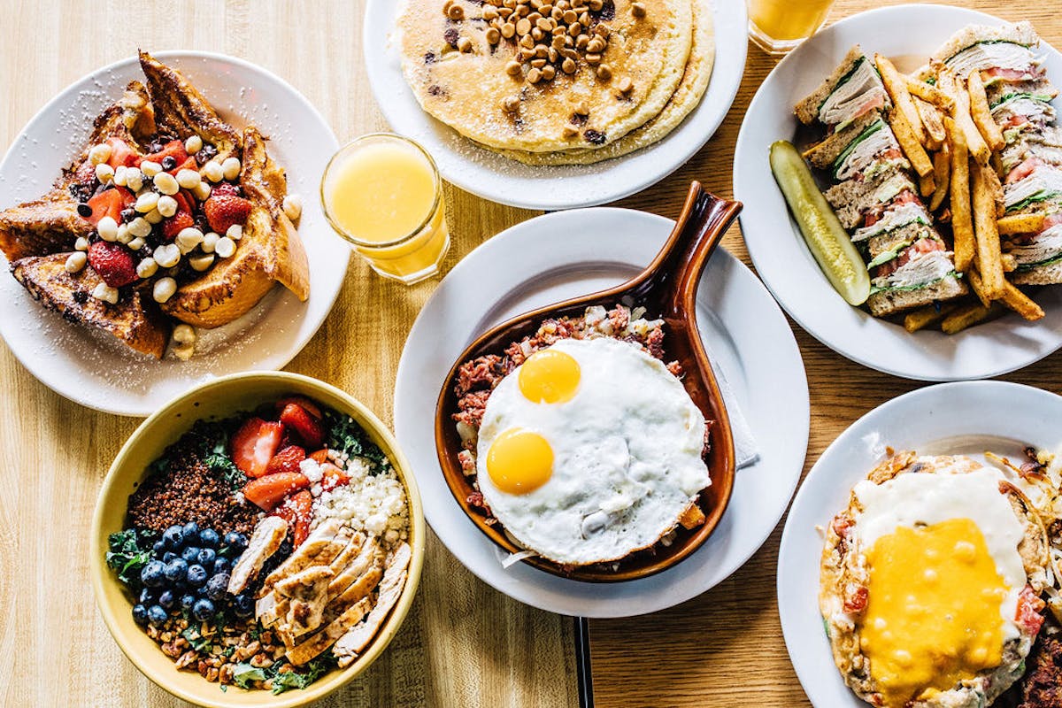 a plate is filled with different types of food on a table