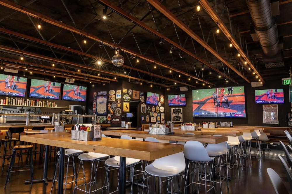 a group of people sitting at a table in a restaurant