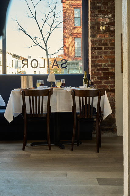 a dining room table in front of a window