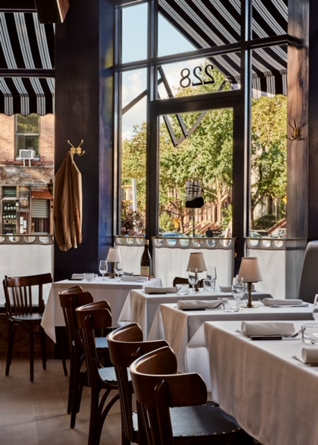 a dining room table in front of a window