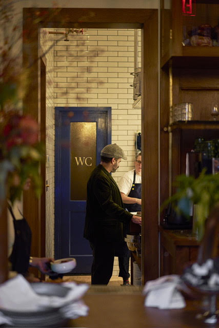 a man and a woman standing in a room