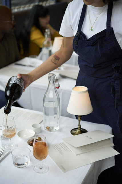 a person holding a glass of wine