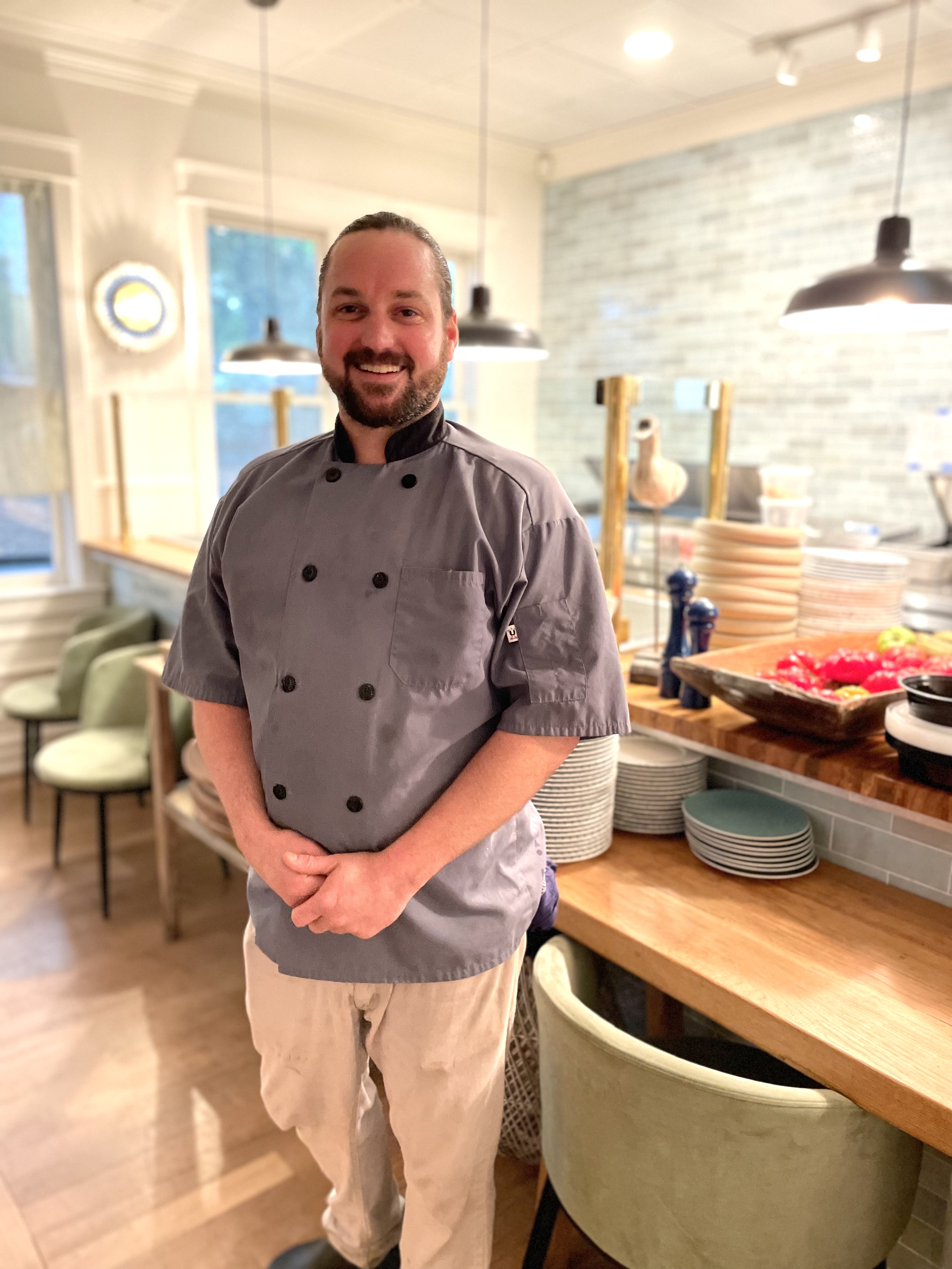 a man standing in a kitchen