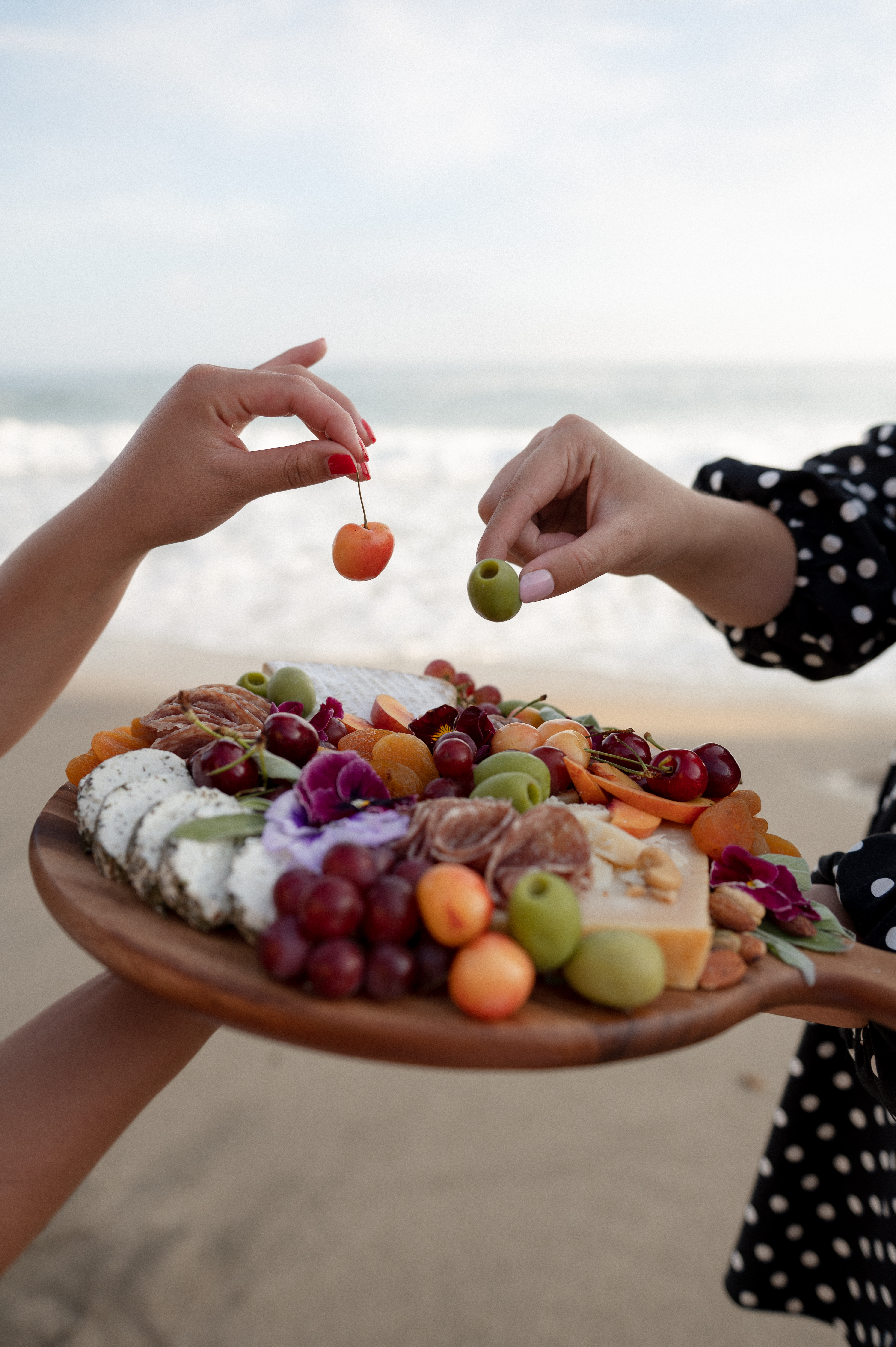 a woman holding a plate of food